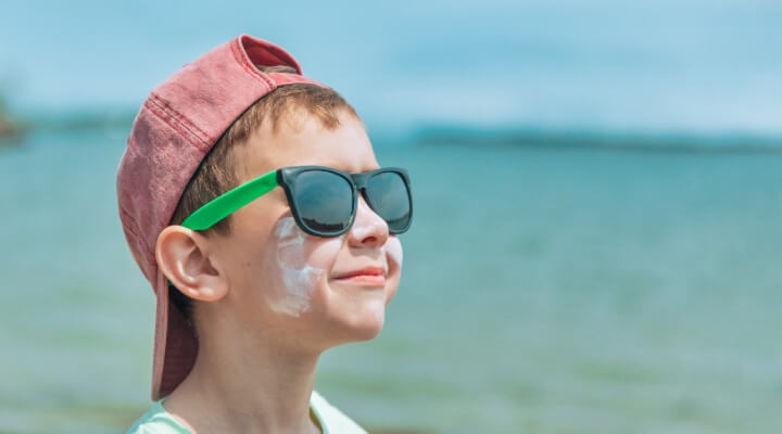 boy with sunscreen on face